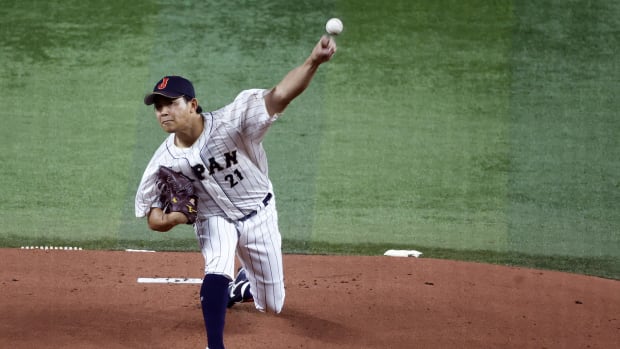 Mar 21, 2023; Miami, Florida, USA; Japan starting pitcher Shota Imanaga (21) pitches against the USA in the first inning at LoanDepot Park. Mandatory Credit: Rhona Wise-USA TODAY Sports  